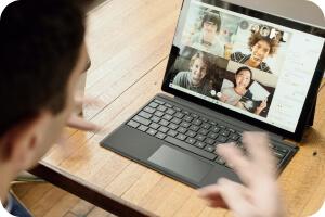 a laptop showing a zoom call